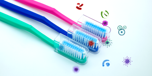 Antibacterial toothbrush cap shown on a toothbrush head. The cap is designed to inhibit bacterial growth, featuring antimicrobial materials or ventilation to prevent moisture buildup.